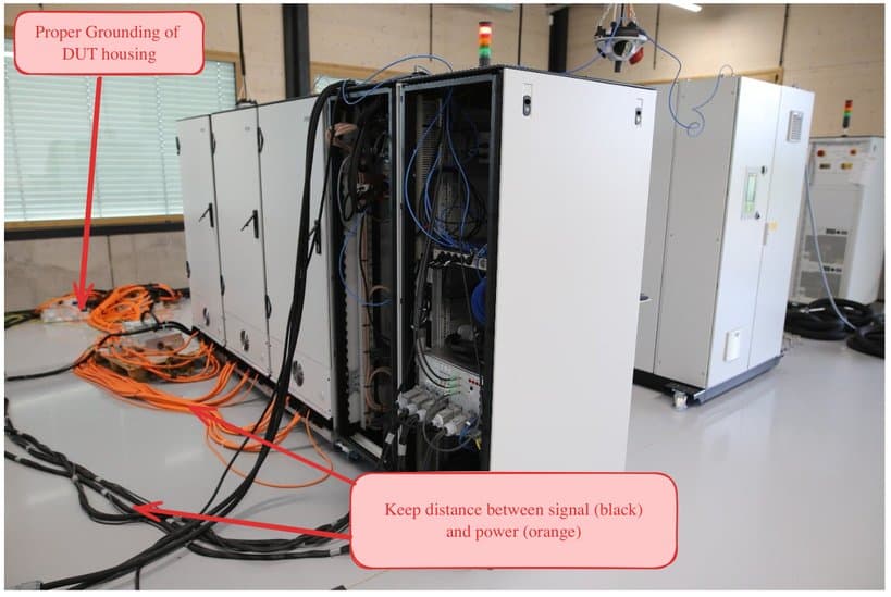 Proper grounding of the DUT housing; keep distance between signal (black) and power (orange) cables